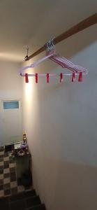 a room with a staircase with a light on the wall at ELTARI Pine House in Kidal