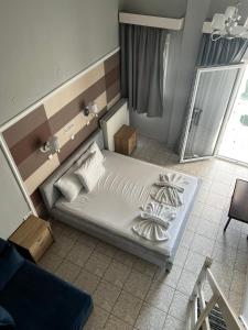 Postel nebo postele na pokoji v ubytování Ellas Hotel