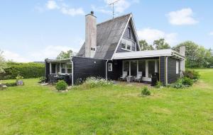 a black house with a gambrel roof at Awesome Home In Skibby With Wifi in Skibby +10 photos