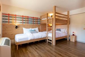 Una cama o camas en una habitación de Explorer Rest & Recreation