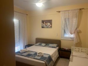 Ένα ή περισσότερα κρεβάτια σε δωμάτιο στο Iliana House