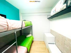 A bed or beds in a room at Elegance Plaza - Salou Suites