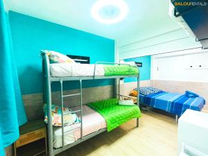 A bed or beds in a room at Elegance Plaza - Salou Suites