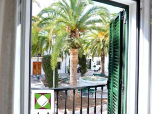 A balcony or terrace at Palm House 10