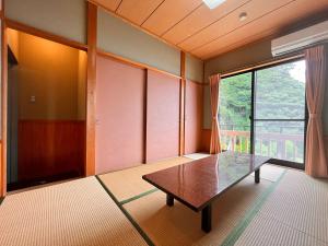 Ένα ή περισσότερα κρεβάτια σε δωμάτιο στο 海辺のスパイスヴィラ　Ｃｏｙａｍａｒｉｓ