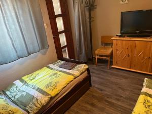 Posteľ alebo postele v izbe v ubytovaní Z&T Apartmanok