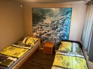 Posteľ alebo postele v izbe v ubytovaní Z&T Apartmanok
