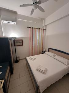 Postel nebo postele na pokoji v ubytování Casa dei gelsomini