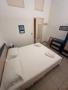 Postel nebo postele na pokoji v ubytování Casa dei gelsomini