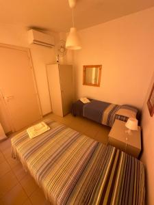 Postel nebo postele na pokoji v ubytování Casa dei gelsomini
