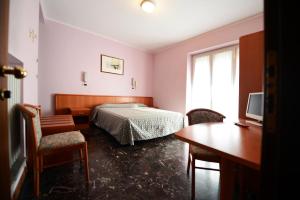 Postel nebo postele na pokoji v ubytování Albergo Venaria Reale da Matteo