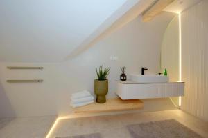 a bathroom with a sink and a mirror at Apartamenty Blanca in Łeba +238 photos