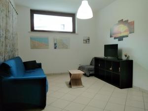 A television and/or entertainment centre at Appartamento La Bonifica