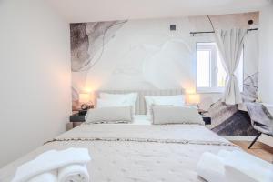 Postel nebo postele na pokoji v ubytování Luxury apartments Marino near beach