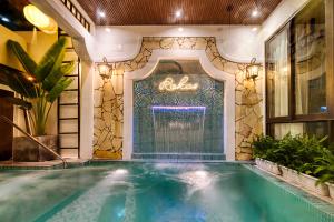 Bazén v ubytování Rokas Hoi An Boutique Hotel nebo v jeho okolí