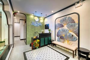 TV a/nebo společenská místnost v ubytování Rokas Hoi An Boutique Hotel