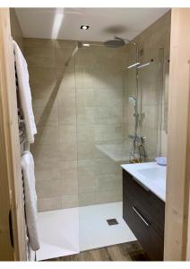 a bathroom with a shower and a sink at Appartement LE 351 in Les Gets +30 photos