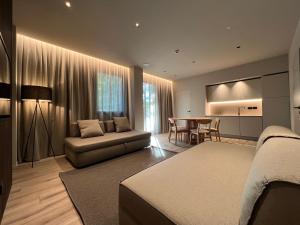 a living room with a couch and a table at Evangelisti Palace in Bellaria-Igea Marina