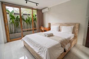 Postel nebo postele na pokoji v ubytování Made Arsa Homestay