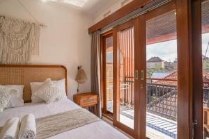 Postel nebo postele na pokoji v ubytování Made Arsa Homestay