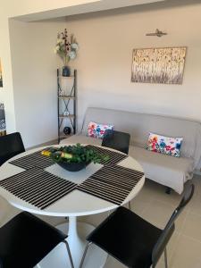 a living room with a table and a couch at Vagias Home in Kanali +6 photos