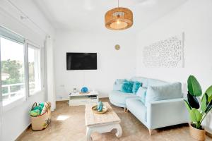 Μια τηλεόραση ή/και κέντρο ψυχαγωγίας στο Seaview Apartment Beachlove Les Deveses Denia