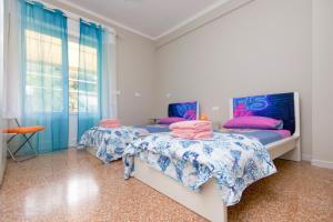 Postel nebo postele na pokoji v ubytování Villa Perla primo piano