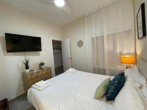 Postel nebo postele na pokoji v ubytování Viento FreshApartments