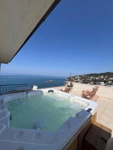 a jacuzzi tub with a view of the ocean at Hotel Pirate Old Town in Ulcinj