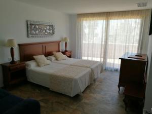 Postel nebo postele na pokoji v ubytování Amanecer Zahara de los Atunes + 2 fotografie