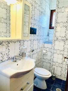 a bathroom with a sink and a toilet at Casa Rea in Francavilla al Mare +17 photos