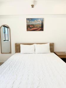 Postel nebo postele na pokoji v ubytování Ngọc Anh Hotel