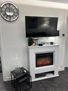Televízia a/alebo spoločenská miestnosť v ubytovaní Wave Apartments- Kołobrzeska