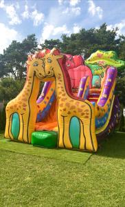 a colorful inflatable ride in a park at Silver Park Resort 10m do plaży in Gąski