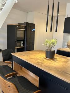 a kitchen with a wooden counter top in a room at Apartment Diva Maria in Stinica +13 photos