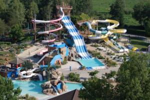 a water park with a bunch of water slides at Gîte des Buis de l'Ain in Groslée