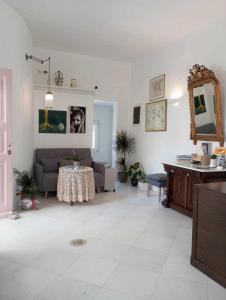 a living room with a couch and a table at Maria Elena - Suite Home in Mikonos +74 photos