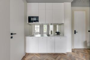 Kuchyňa alebo kuchynka v ubytovaní Apartamenty Gdańsk Piwna