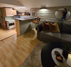 a living room with a couch and a kitchen at Lyngen in Kvalvik +22 photos