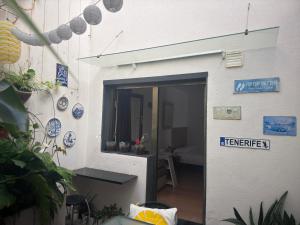 a door with a sign on the side of a building at Beach LOFT Tabaiba in Tabaiba +23 photos
