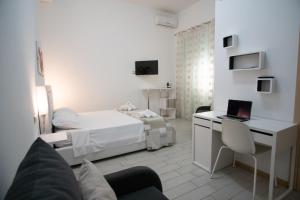 TV a/nebo společenská místnost v ubytování B&B ARCHIMEDE