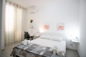 Postel nebo postele na pokoji v ubytování B&B ARCHIMEDE