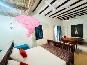 Giường trong phòng chung tại Krishan Villa