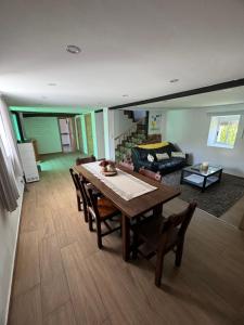 a living room with a table and chairs and a couch at Casa La Molina in Burgos