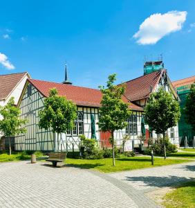 a building with a bench in front of it at SH-Apartments-Stylische FeWo Mia - Parken - Wifi in Schmalkalden +7 photos