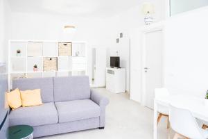 a living room with a couch and a table at Urban loft in Forio d'Ischia