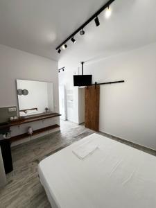 A bed or beds in a room at Three Seasons