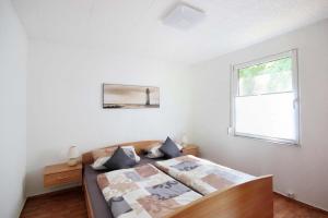 Postel nebo postele na pokoji v ubytování Ferienbungalow Serams by Rujana