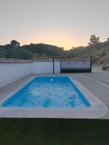 a swimming pool in the middle of a body of water at La Noguera Casa Rural in Huéscar