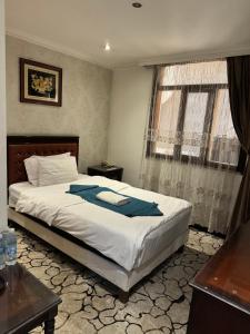 Ένα ή περισσότερα κρεβάτια σε δωμάτιο στο Anwar Dijlah Hotel